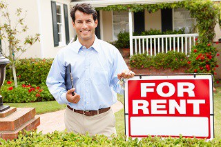 image of renter in front of house